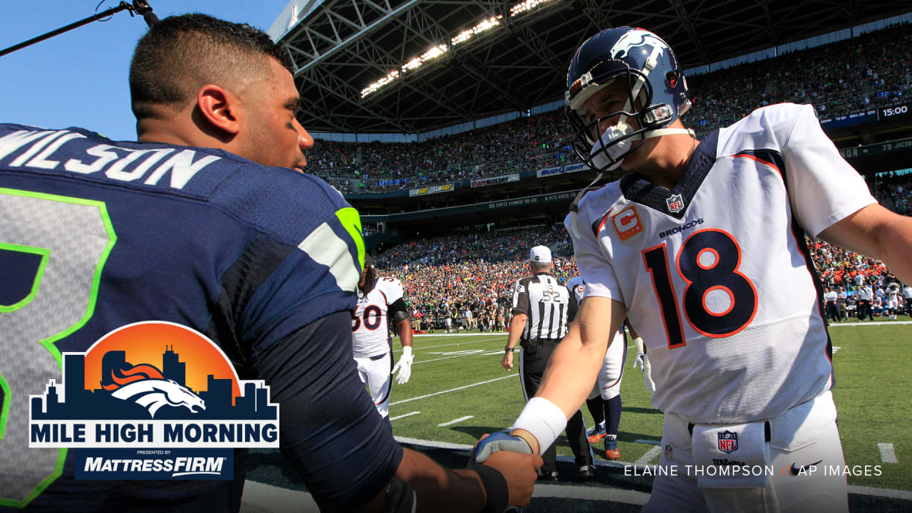 DENVER, CO - APRIL 08: Denver Broncos QB Russell Wilson chats with