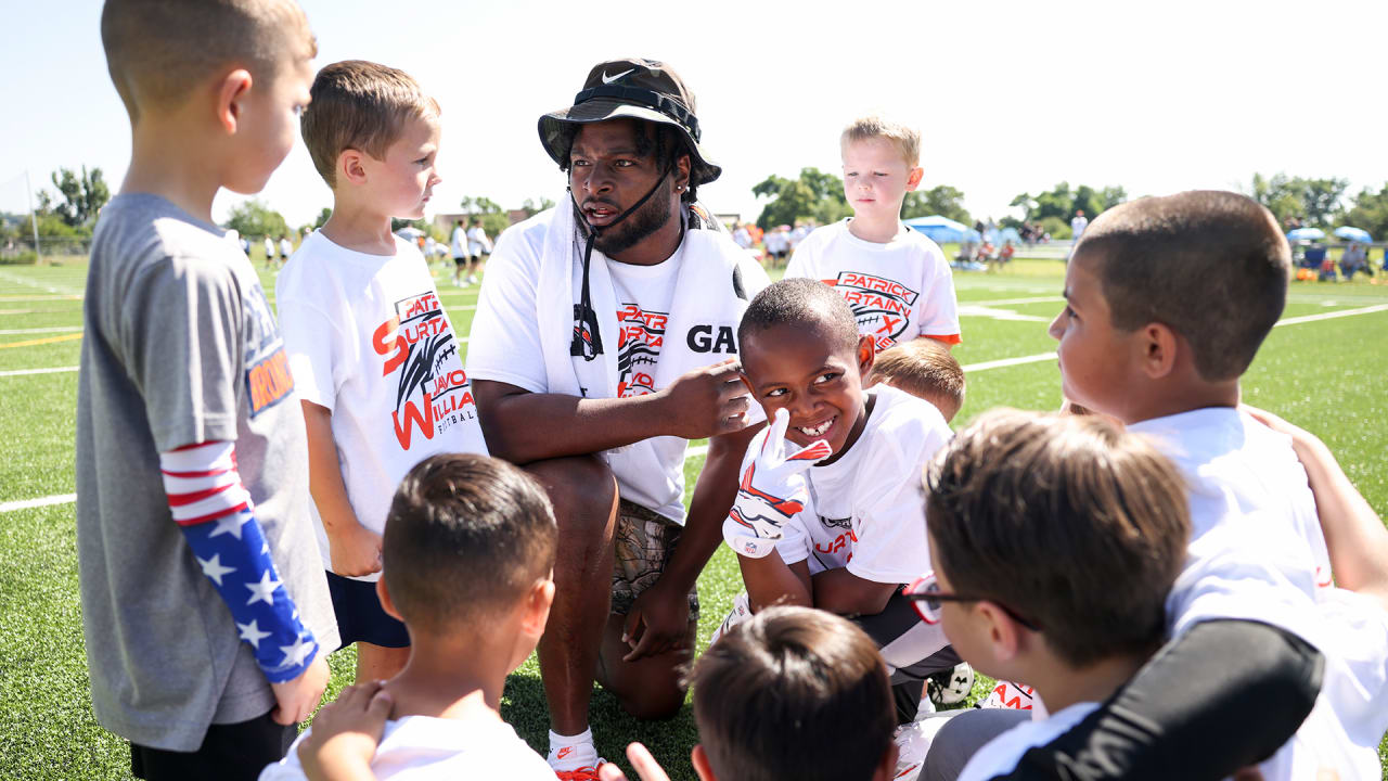 Javonte Williams, Pat Surtain II help inspire next generation at youth  football camp