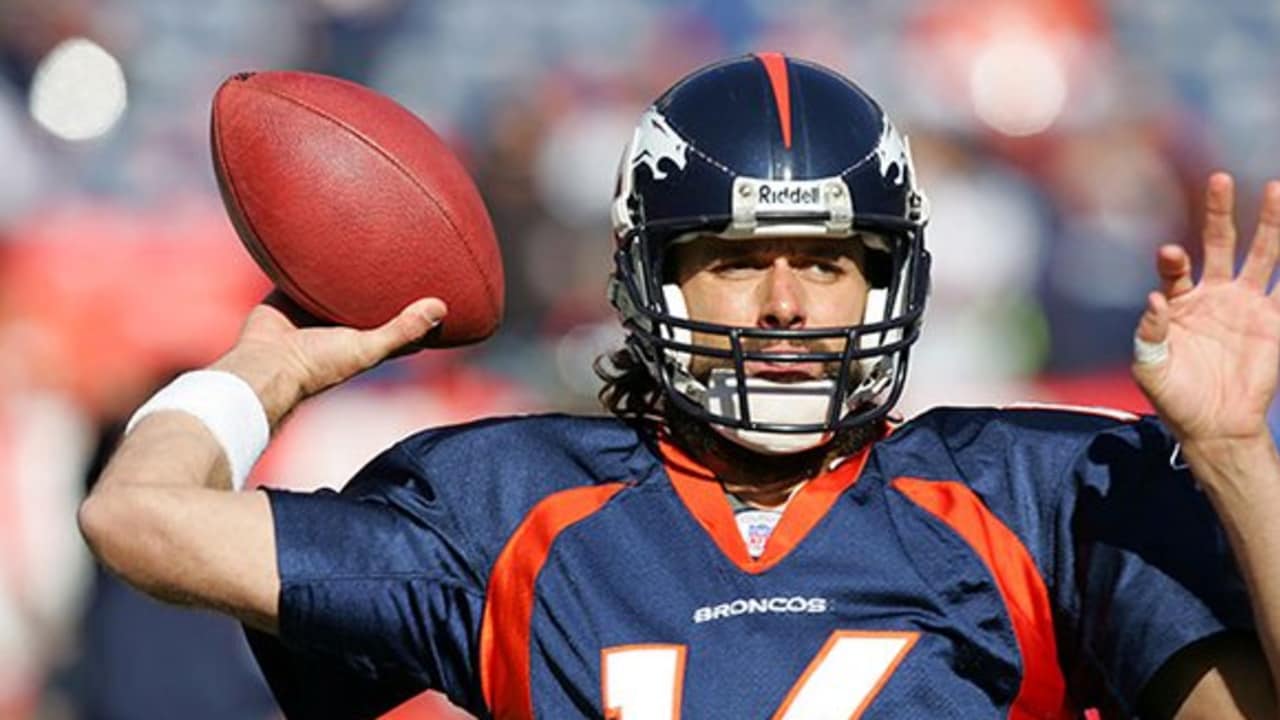 Quarterback Jake Plummer of the Denver Broncos carries the ball