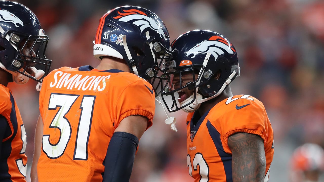 Denver Broncos safeties Justin Simmons, Kareem Jackson give back