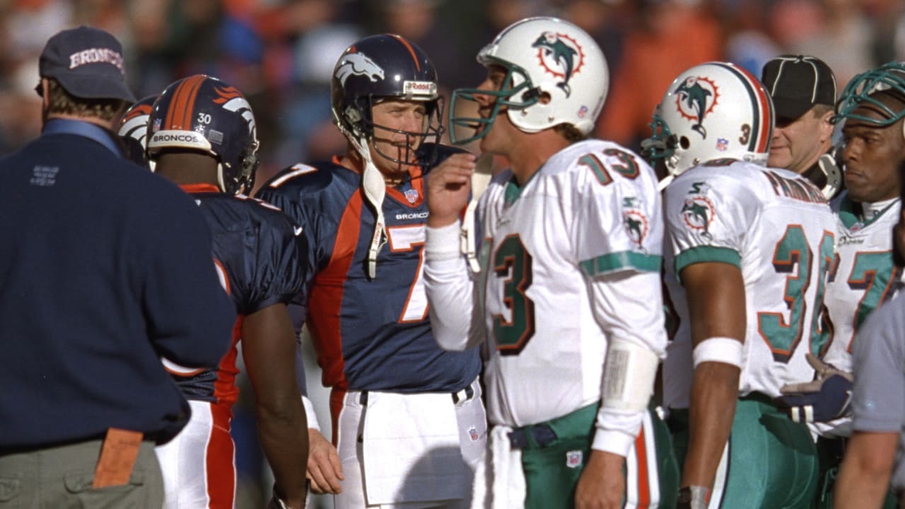 Denver Broncos' John Elway aims a pass downfield during the