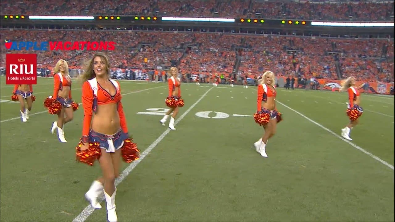 An Arizona Cardinals' cheerleader performs a high kick during the