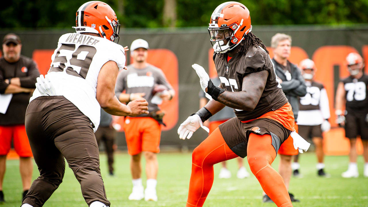 Cleveland Browns offensive tackle James Hudson III (66) walks back to the  line of scrimmage during