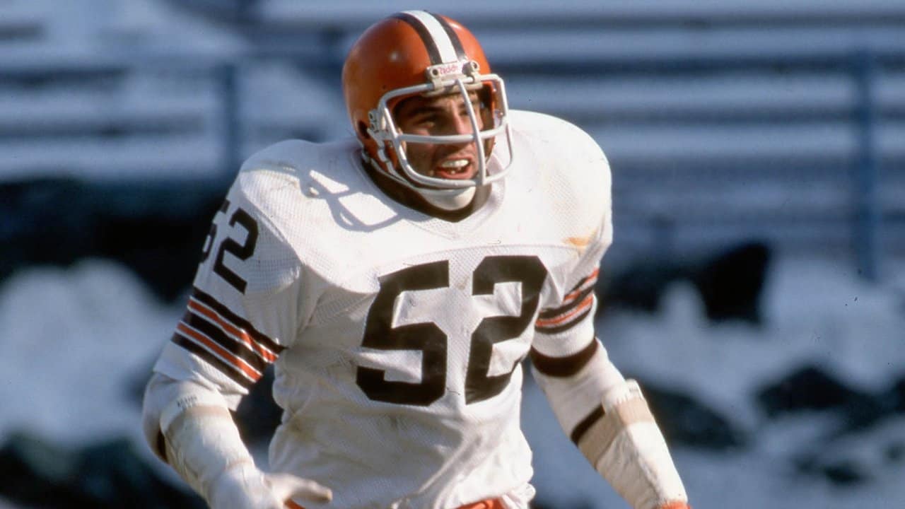 Cleveland Browns coach Sam Rutigliano hugs Cleveland quarterback