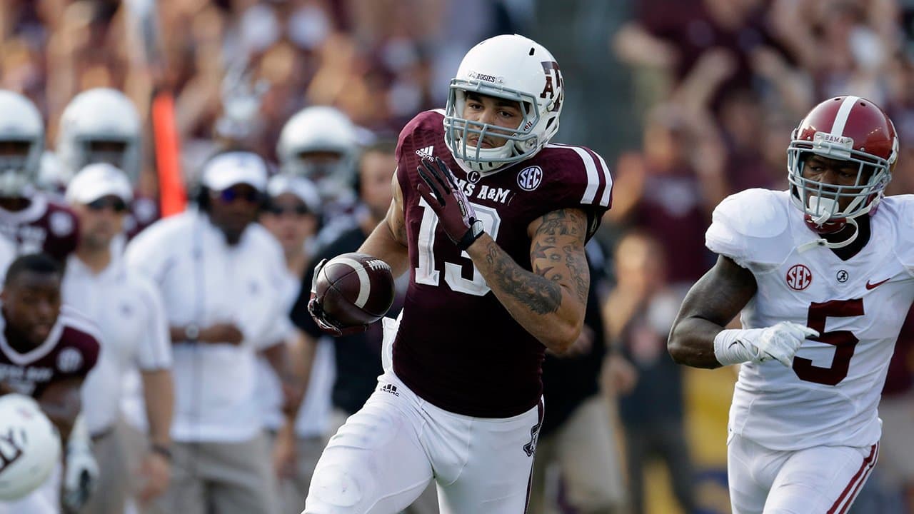 Mike Evans Texas A&M Aggies Unsigned White Jersey Running and Breaking  Tackle with Ball vs. Oklahoma Sooners Photograph