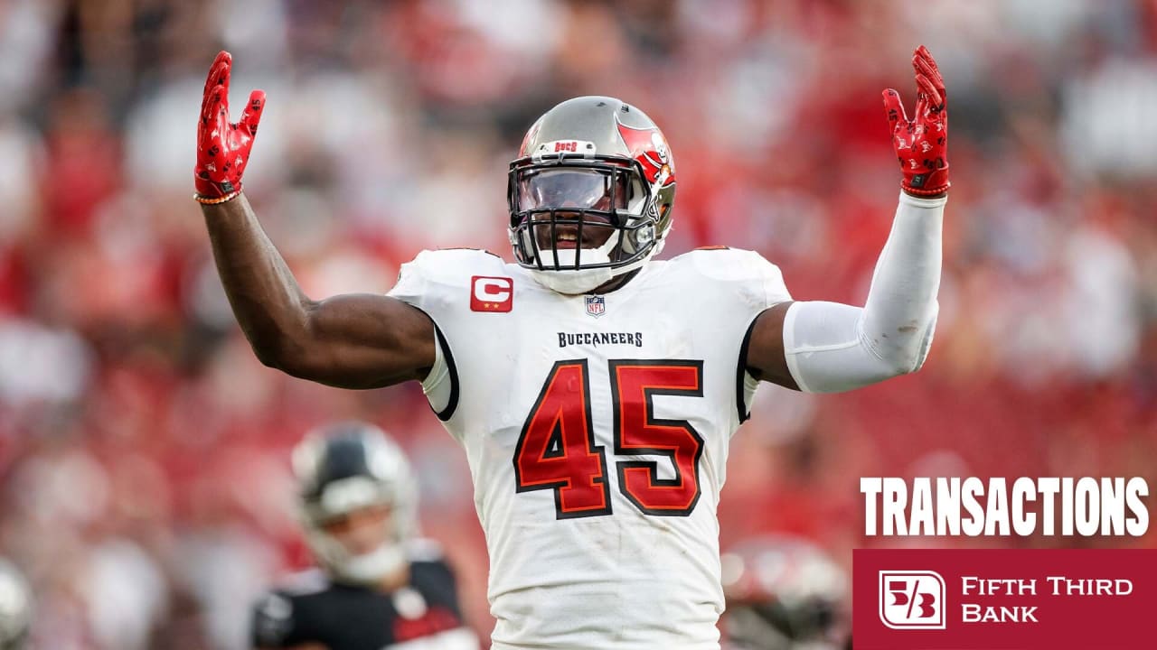 Tampa Bay Buccaneers first-round draft pick Devin White holds his jersey as  he poses for photographers during an NFL football news conference Friday,  April 26, 2019, in Tampa, Fla. White, a linebacker