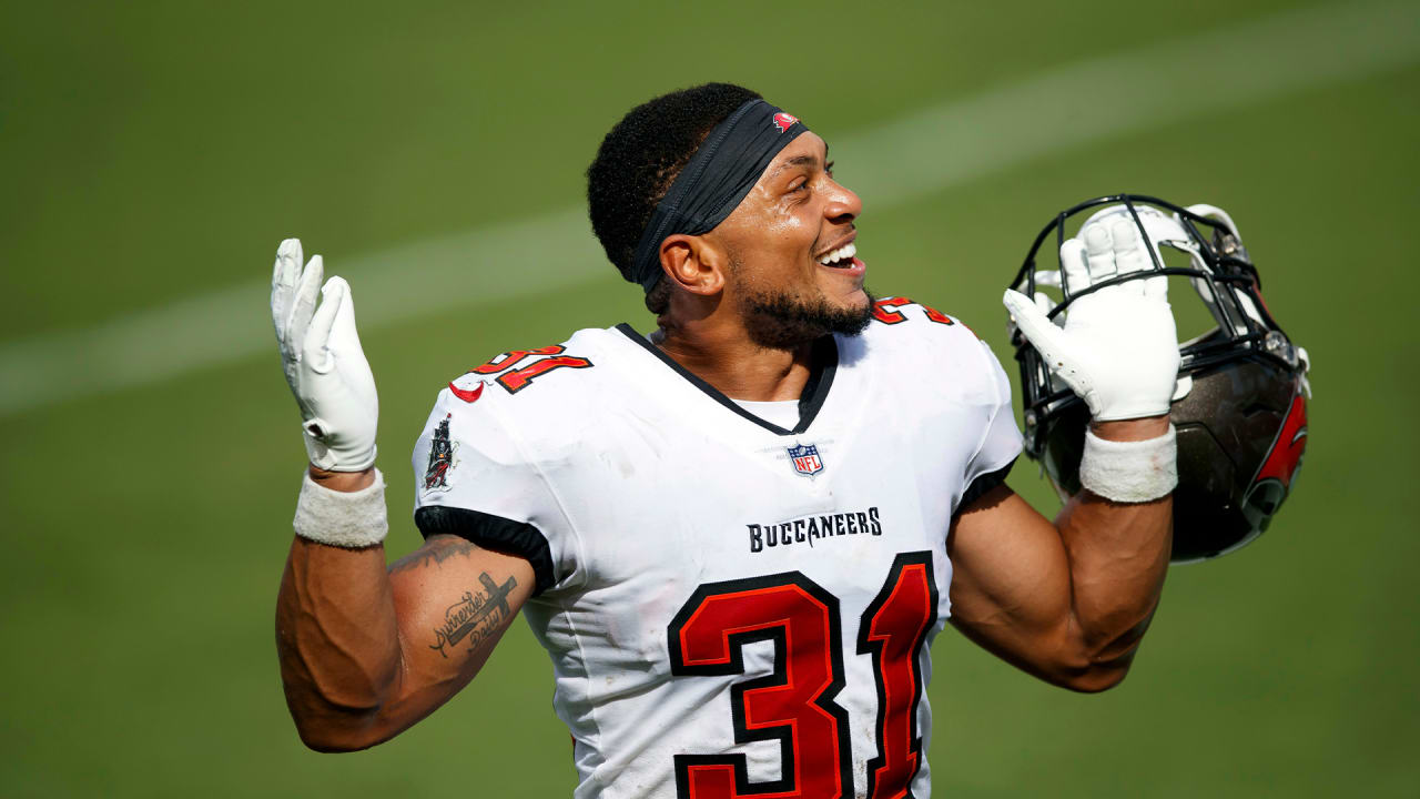 Mike Davis of the Atlanta Falcons is tackled by Antoine Winfield Jr.  News Photo - Getty Images