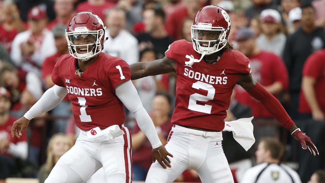 Oklahoma quarterback Kyler Murray holds his up a jersey after the