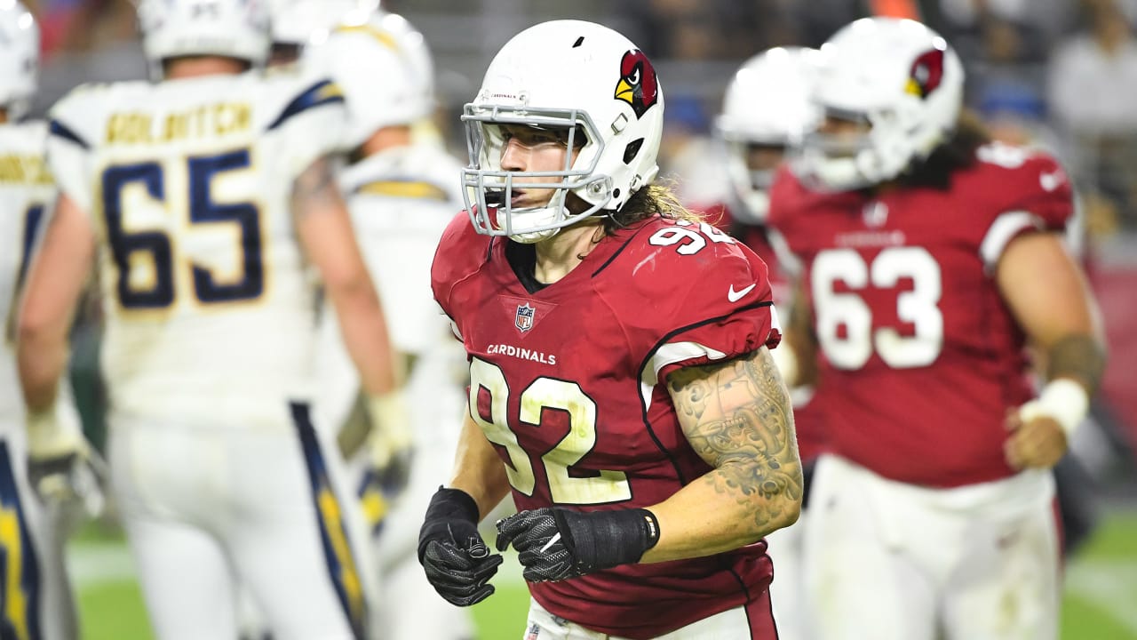 Arizona Cardinals linebacker Dennis Gardeck, top, sacks Denver