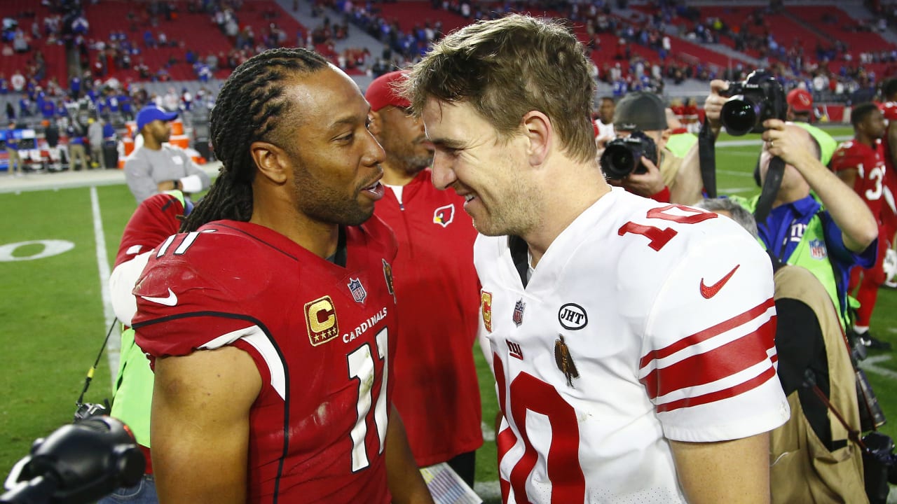 Eli takes picture with fan wearing 'Double Bird' jersey