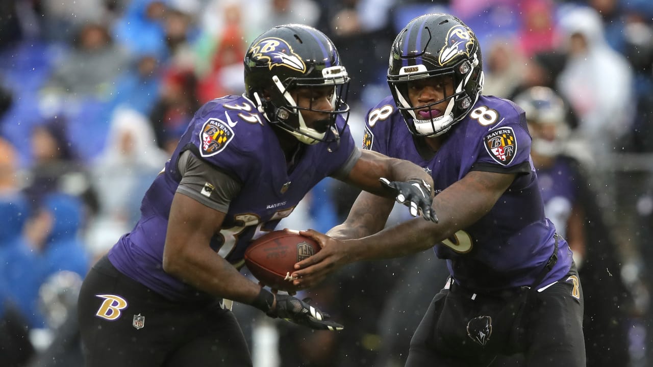 Baltimore Ravens running back Gus Edwards (35) runs with the ball