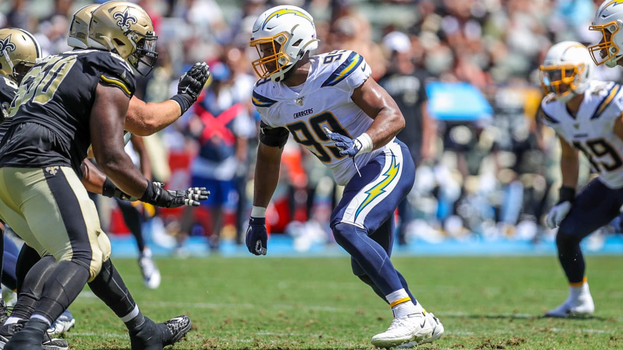 Los Angeles Chargers NFL football defensive tackle Jerry Tillery poses with  a jersey during a news conference at Chargers headquarters Friday, April  26, 2019, in Costa Mesa, Calif. The Notre Dame defensive