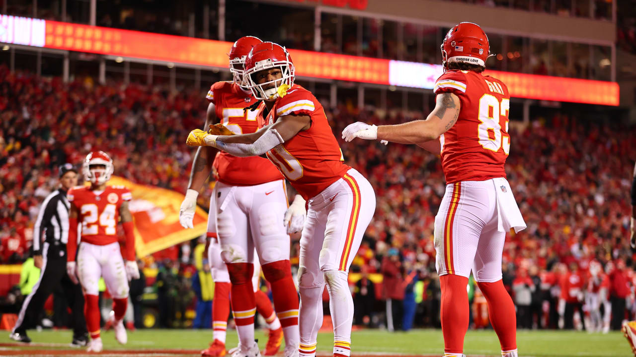 Kansas City Chiefs running back Isiah Pacheco celebrates with fans