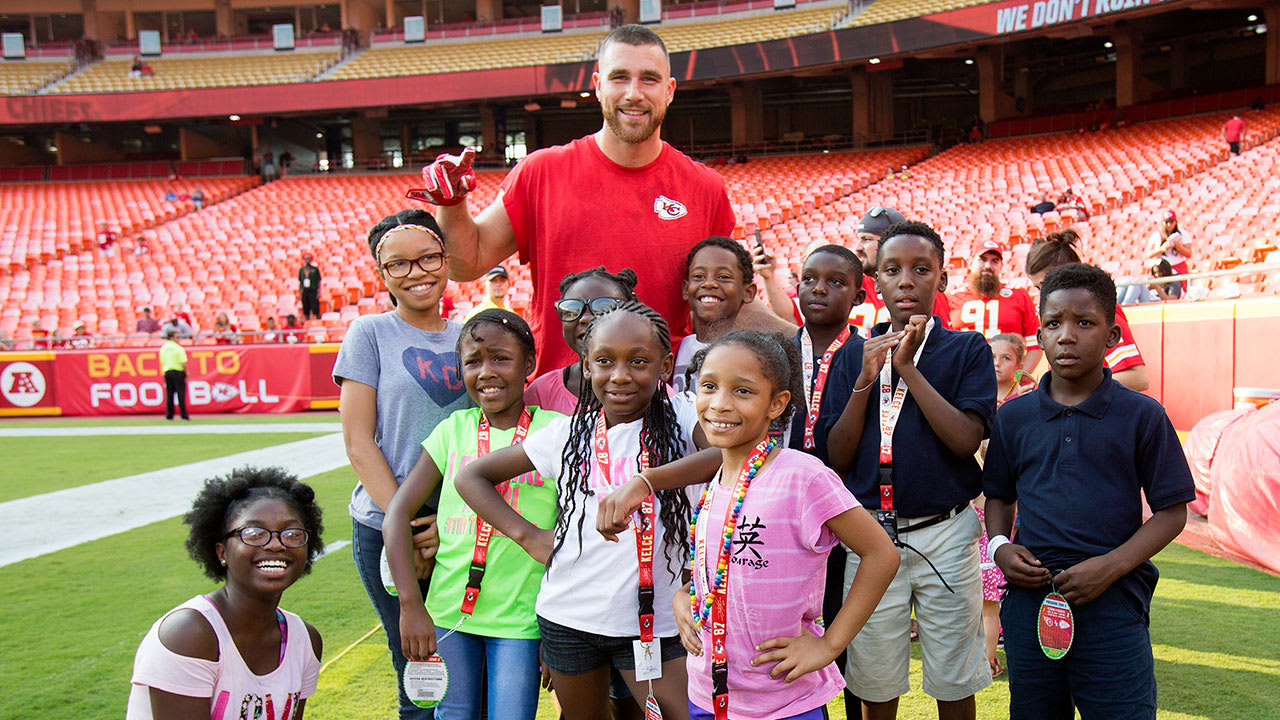 Travis Kelce and girls at Walk the Walk event