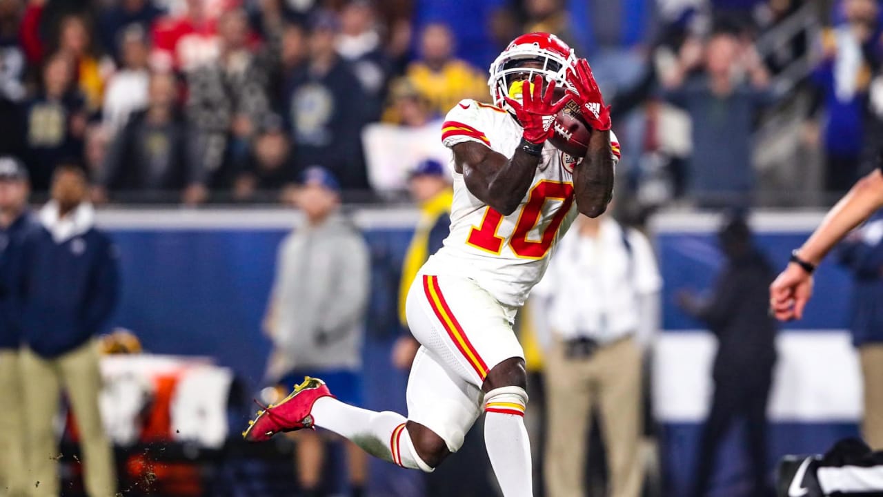 Kansas City Chiefs quarterback Patrick Mahomes (15) celebrates with tight  end Travis Kelce (87) after throwing a 67-yard touchdown pass to Tyreek  Hill during the first quarter of an NFL football game