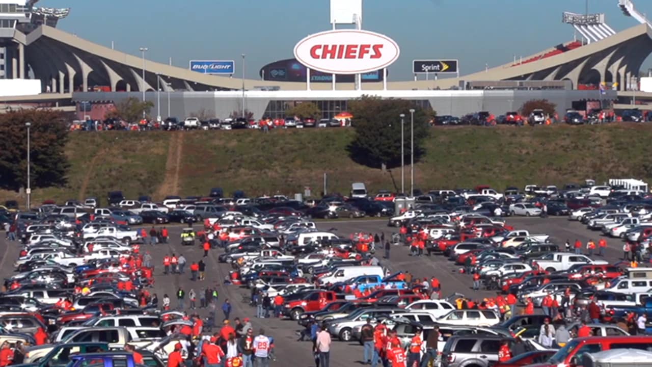 Cars are parked in a mostly empty parking lot at Arrowhead Stadium before  an NFL football game …