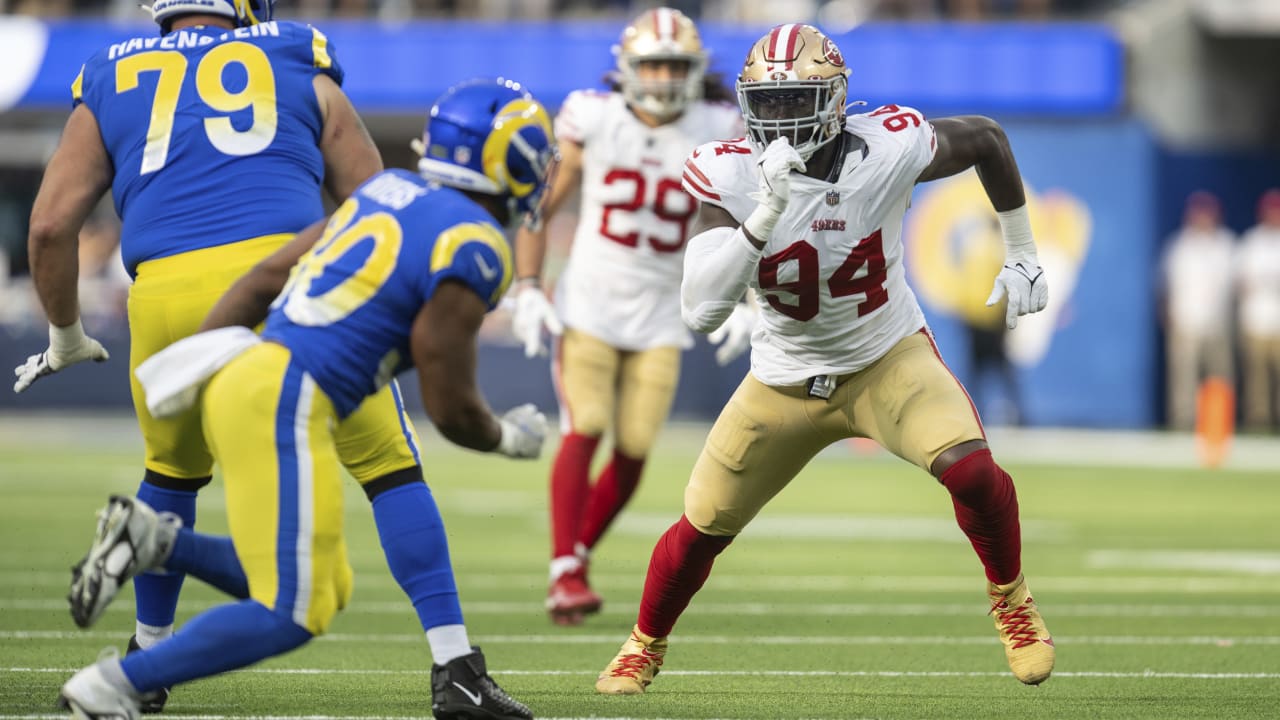 San Francisco 49ers defensive end Charles Omenihu poses with San