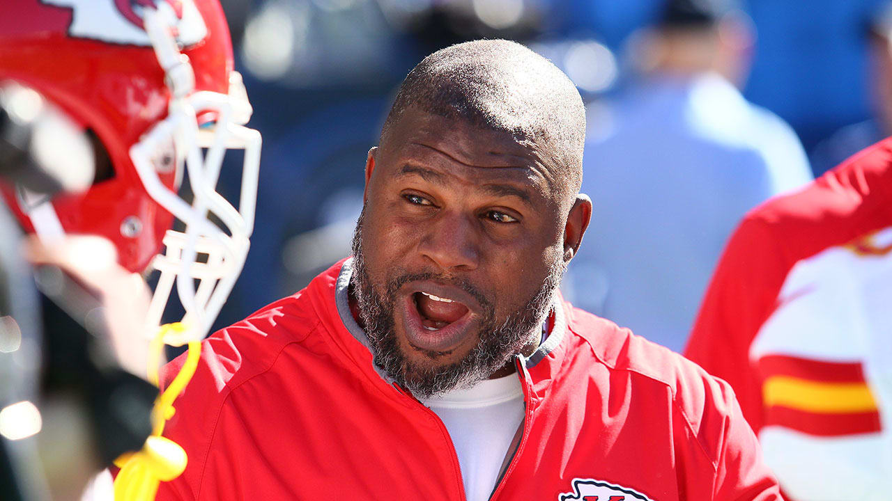 Kansas City Chiefs offensive coordinator Eric Bieniemy talks to