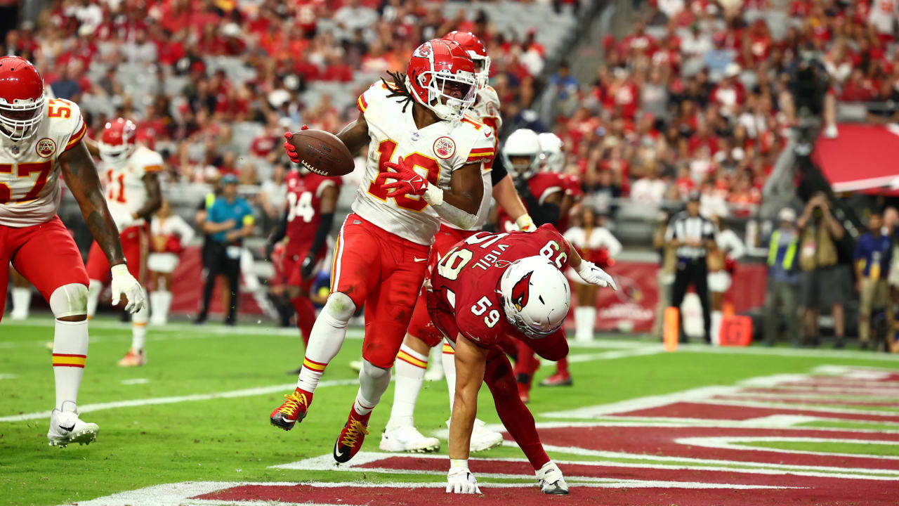 Kansas City Chiefs running back Isiah Pacheco celebrates with fans