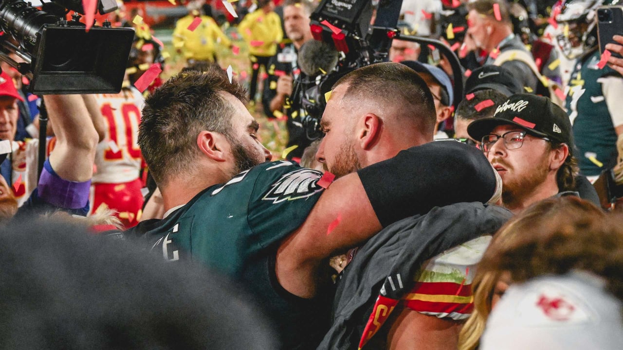 5) Kelce brothers embrace after playing on opposing sides of an  action-packed Super Bowl