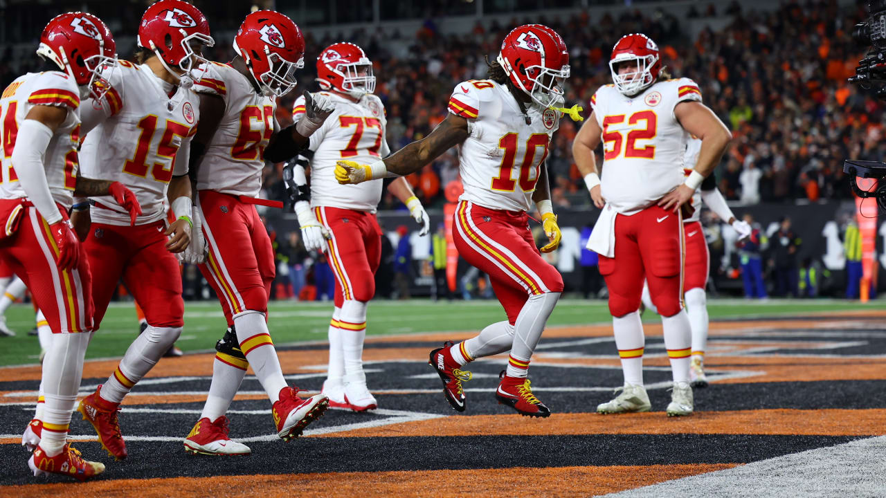 Kansas City Chiefs running back Isiah Pacheco celebrates with fans