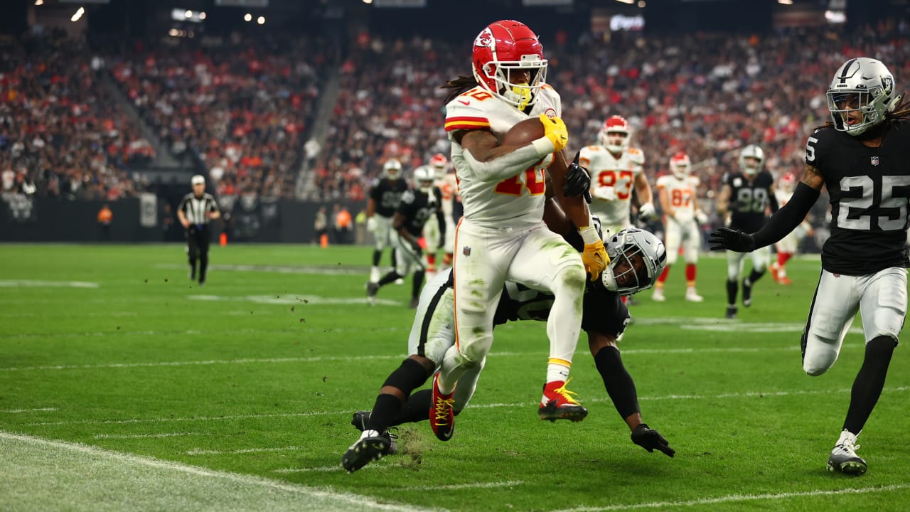 Kansas City Chiefs running back Isiah Pacheco celebrates with fans