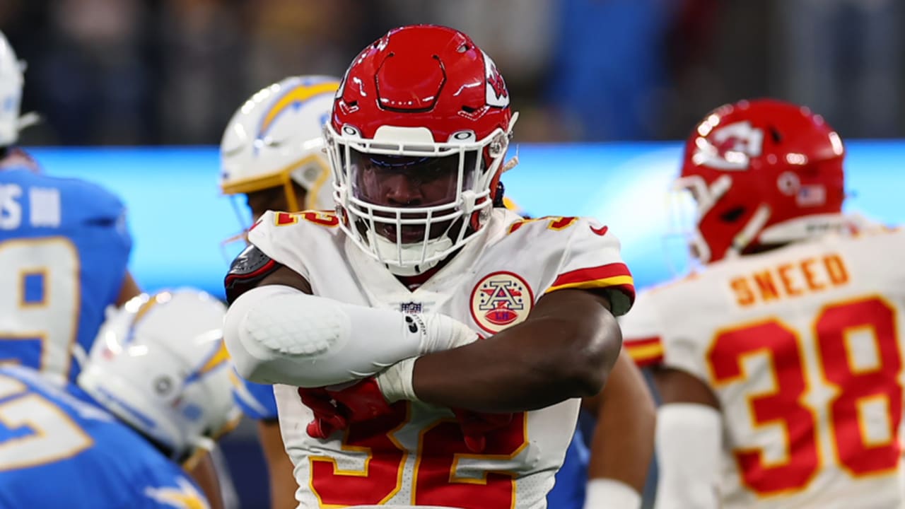 Kansas City Chiefs linebacker Nick Bolton jars the ball away