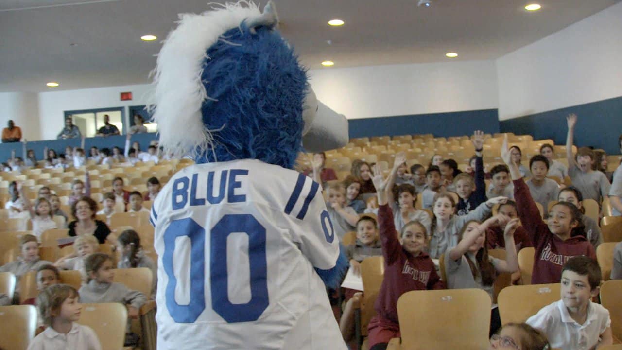 18 December 2011: Indianapolis Colts mascot Blue stiff-arms a your players  at halftime during game