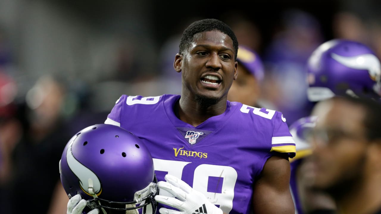 FILE - In this Oct. 24, 2019, file photo, Minnesota Vikings cornerback  Xavier Rhodes (29) breaks up a pass intended for Washington Redskins wide  receiver Terry McLaurin (17) during the first half