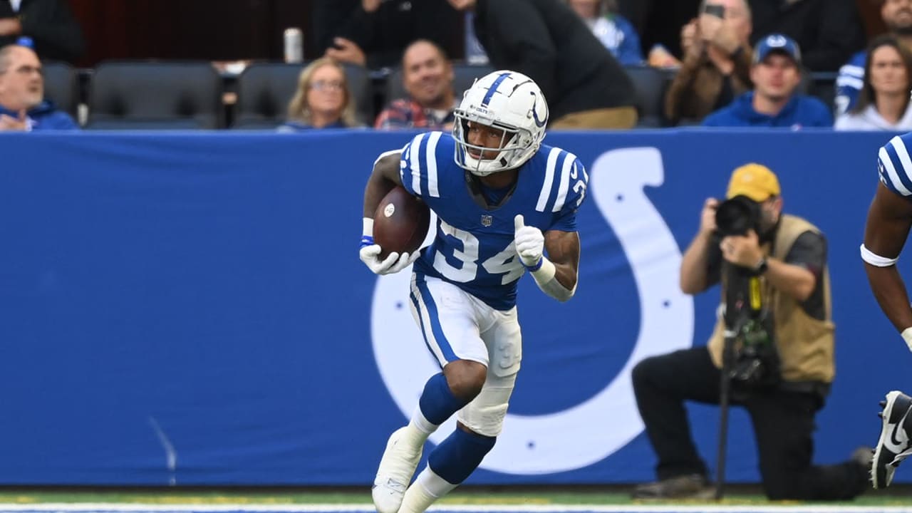 Indianapolis Colts cornerback Isaiah Rodgers (34) reacts after intercepting  the ball against th …