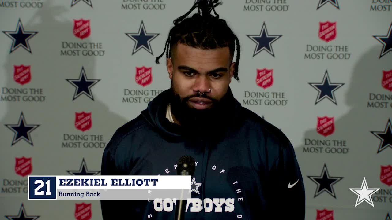 Zeke puts Dak in Salvation Army Red Kettle 