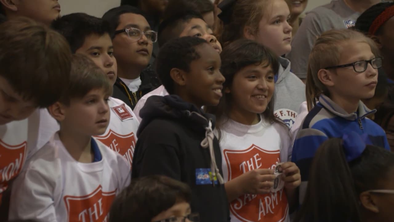 Cowboys receive joy in serving early Thanksgiving at Salvation Army