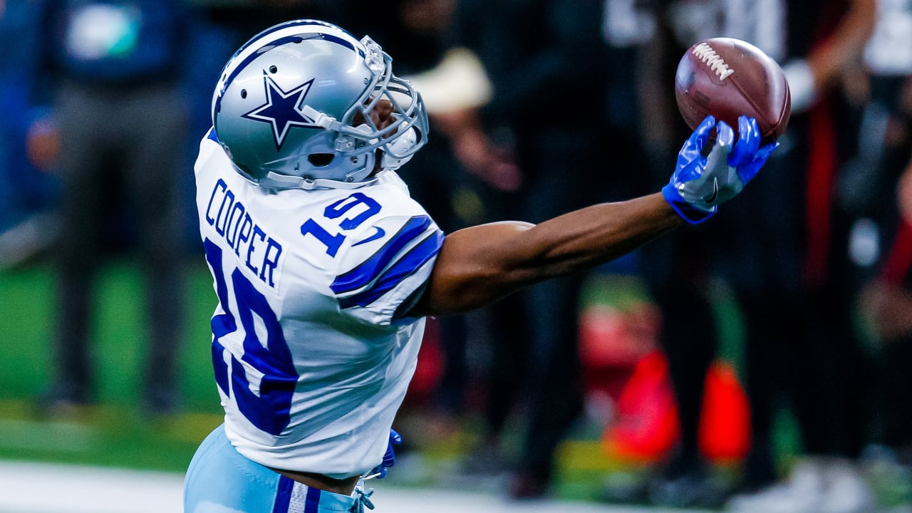 Amari Cooper of the Dallas Cowboys makes a touchdown pass