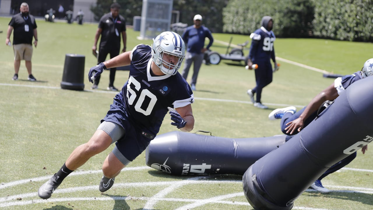 Dallas Cowboys defensive lineman Isaac Alarcon (60) runs onto the