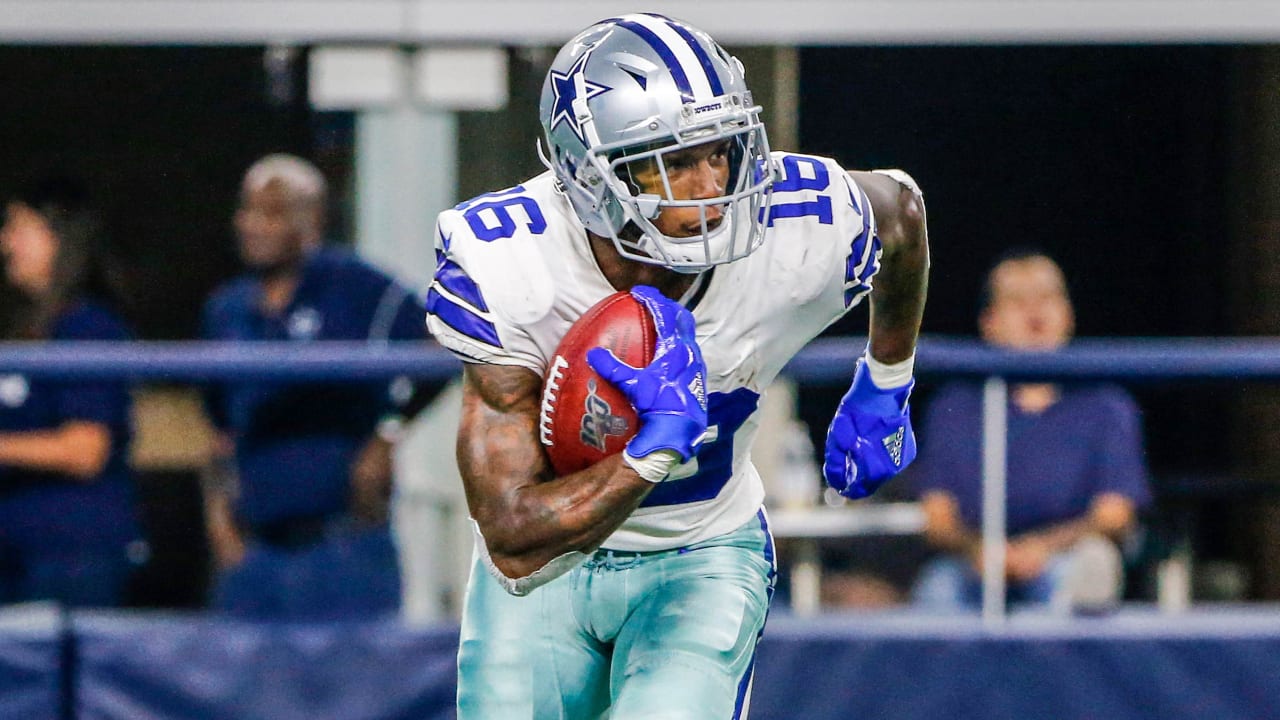 Dallas Cowboys wide receiver Cedrick Wilson (11) gains first down yardage  after catching a pass in the first half of an NFL football game against the  New York Giants in Arlington, Texas