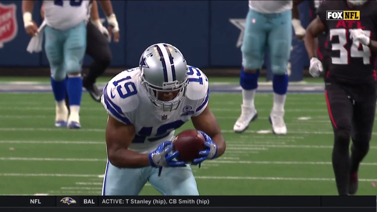 Amari Cooper of the Dallas Cowboys makes a touchdown pass