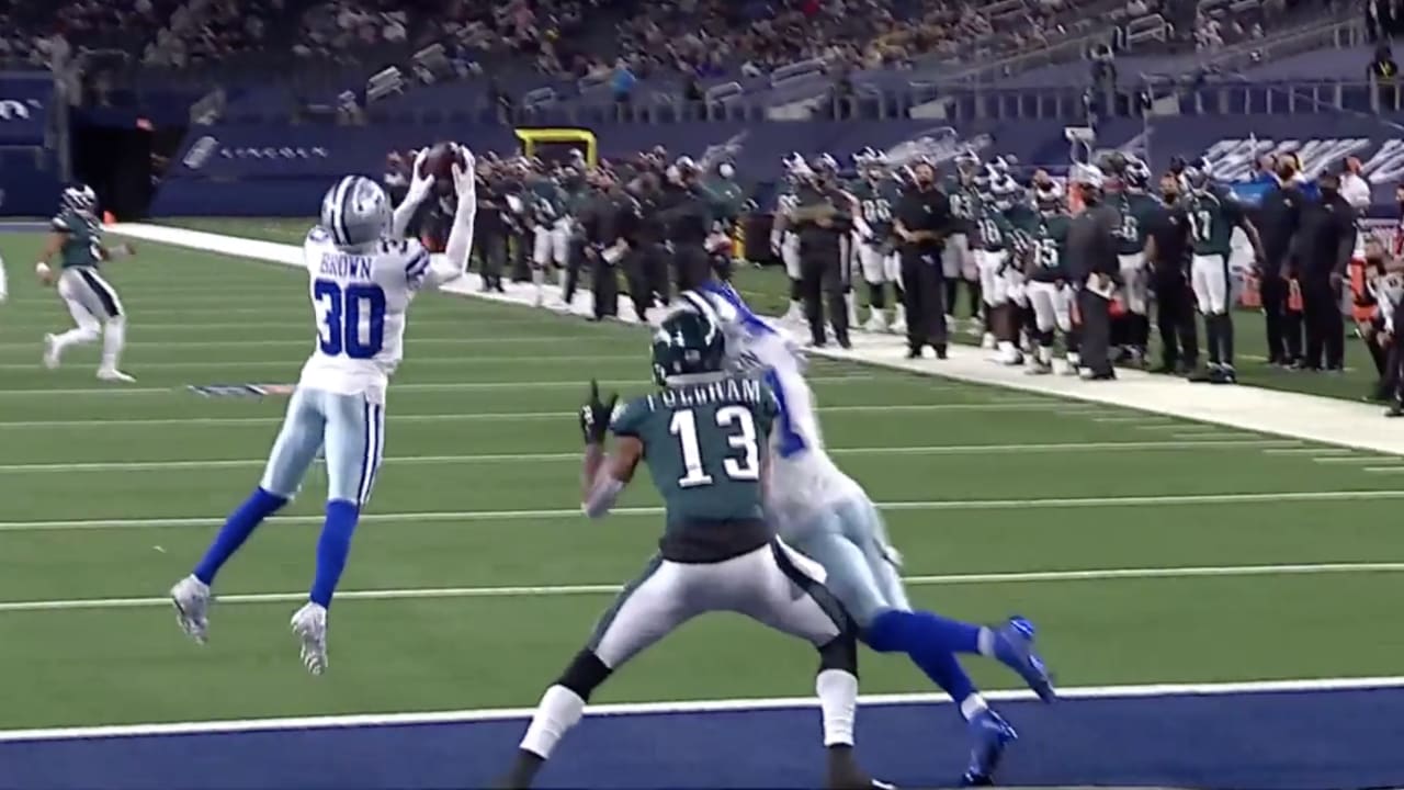 Dallas Cowboys cornerback Trevon Diggs (7) and safety Jayron Kearse (27)  celebrate after Diggs intercepted a Philadelphia Eagles' Jalen Hurts pass  and returned it for a touchdown in the second half of