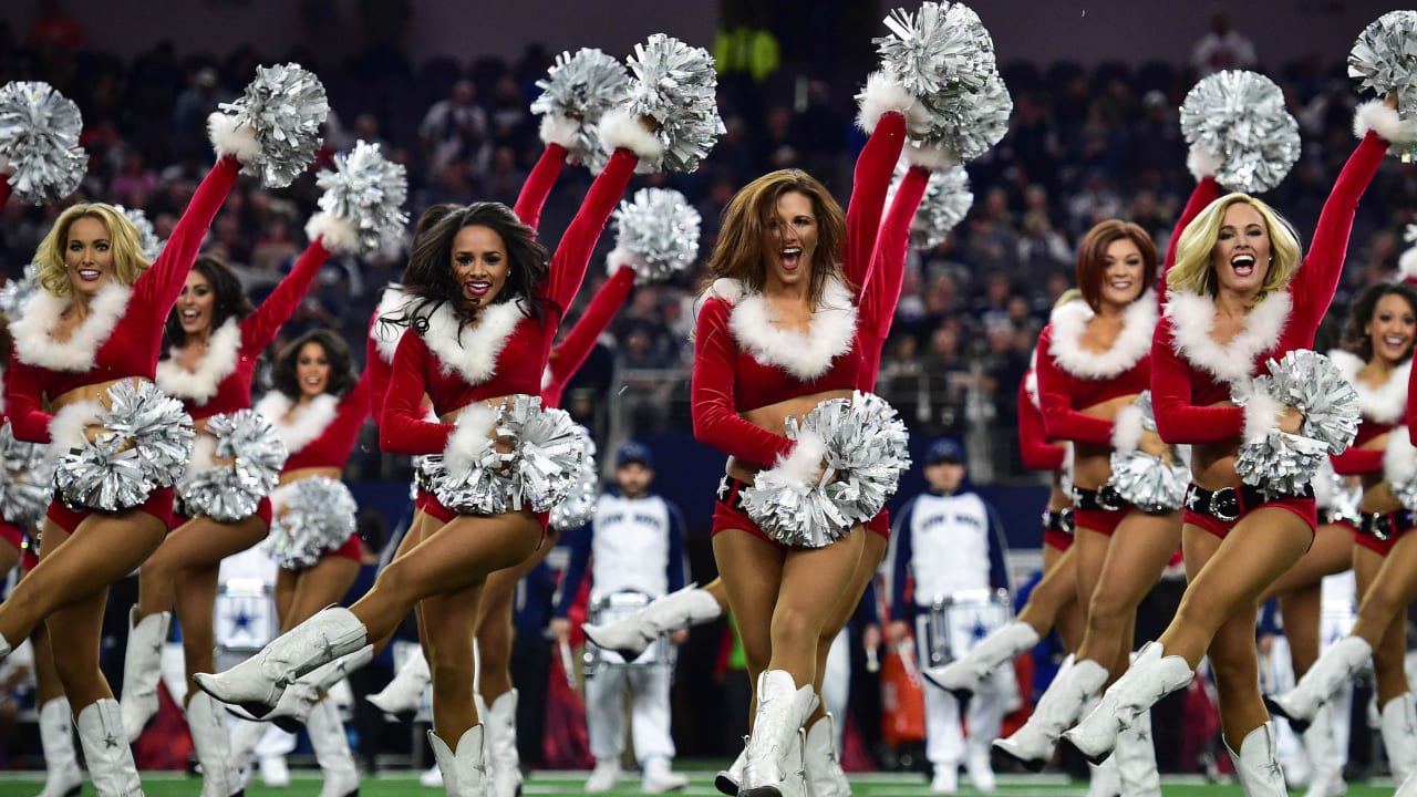 Dallas Cowboys cheerleader performs at halftime in her Santa Claus