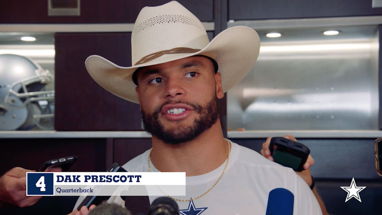 CowBuzz: Dak Tips His Cowboy Hat After Signing