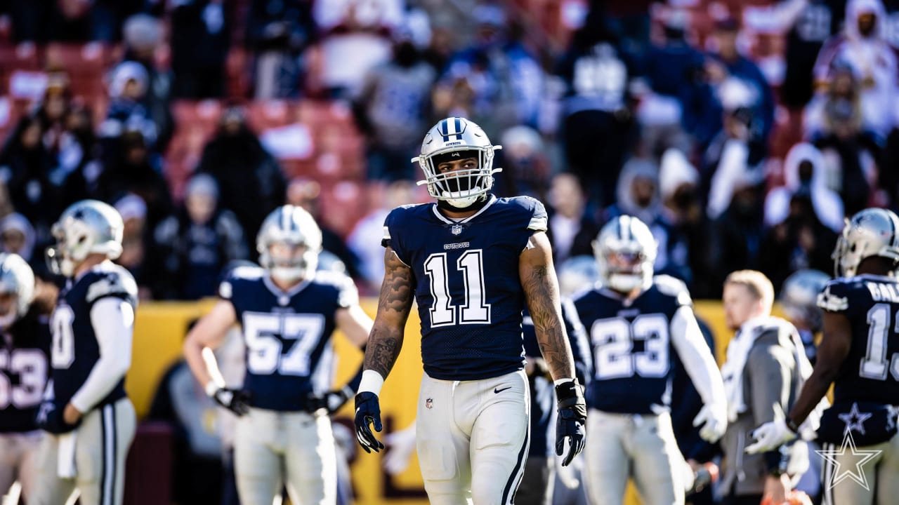 Dallas Cowboys running back Corey Clement (32) runs the ball during the  first quarter of an NFL football game against the Washington Football Team,  Sunday, Dec. 12, 2021, in Landover, Md. (AP