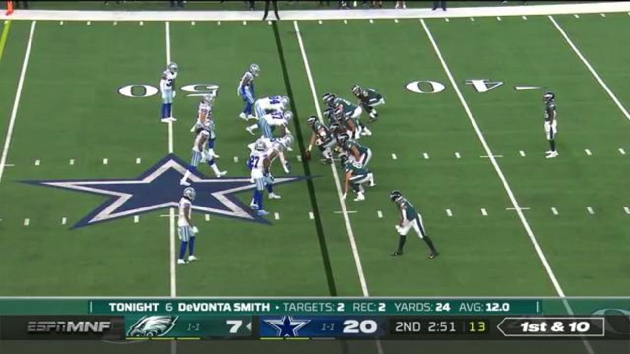 Dallas Cowboys linebacker Micah Parsons (11), middle linebacker Jaylon  Smith (9) and defensive tackle Osa Odighizuwa (97) combine to tackle  Philadelphia Eagles quarterback Jalen Hurts (1) during an NFL football  game, Monday