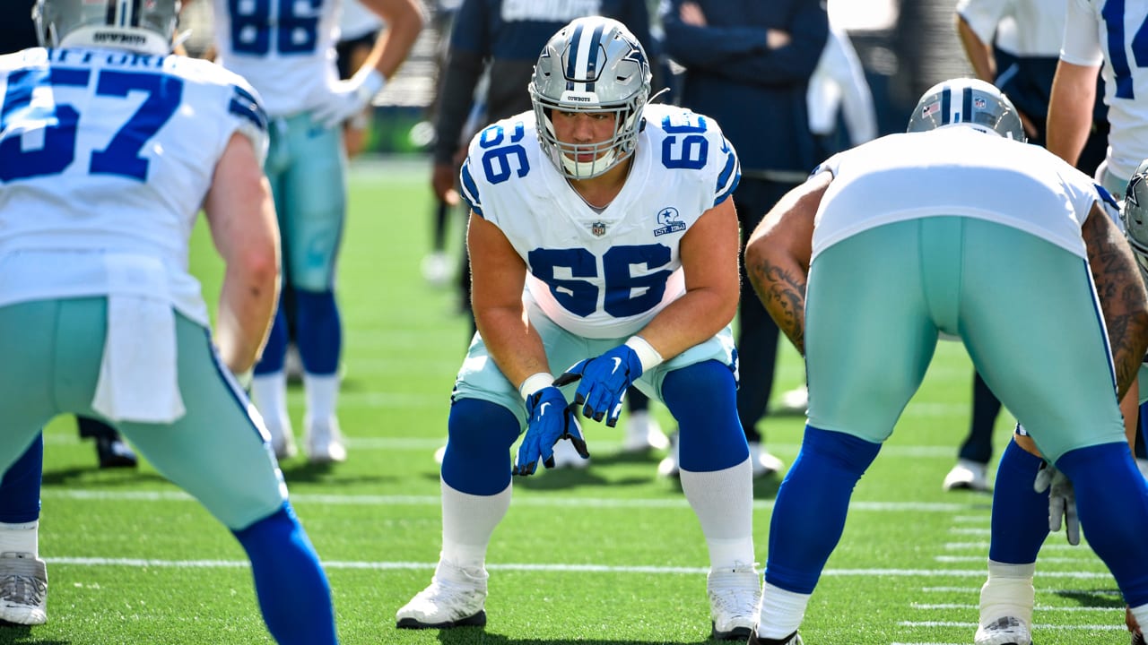 Dallas Cowboys guard Connor McGovern (66) is helped off the field by team  medical staff after suffering an unknown injury in the first half of a NFL  football game against the Tampa