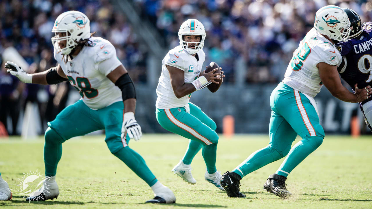 Tua Tagovailoa and River Cracraft of the Miami Dolphins celebrate