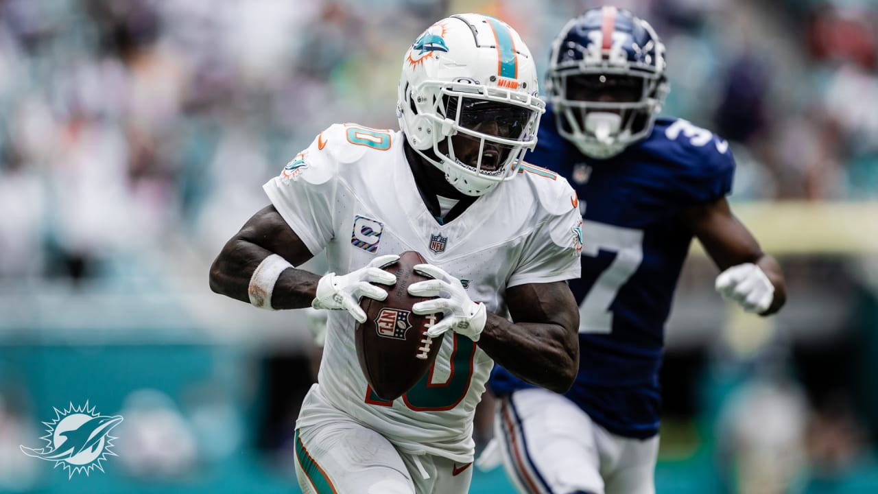 Tyreek Hill of the Miami Dolphins celebrates a touchdown catch