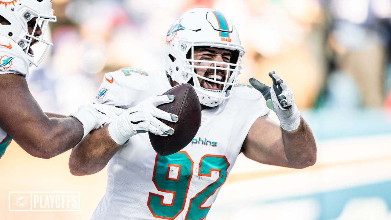 Miami Dolphins defensive tackle Zach Sieler (92) walks back to the