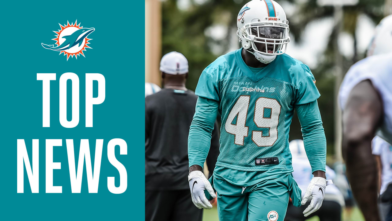 Miami Dolphins linebacker Sam Eguavoen (49) and Miami Dolphins