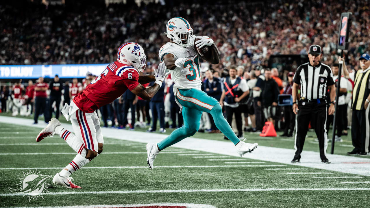 Raheem Mostert of the Miami Dolphins celebrates his touchdown with