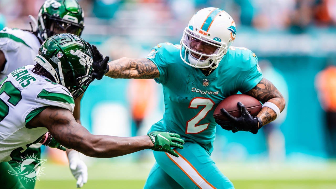 Miami Dolphins running back Myles Gaskin, left, is tackled by New England  Patriots cornerback Joejuan Williams, right, during the second half of an  NFL football game, Sunday, Sept. 12, 2021, in Foxborough