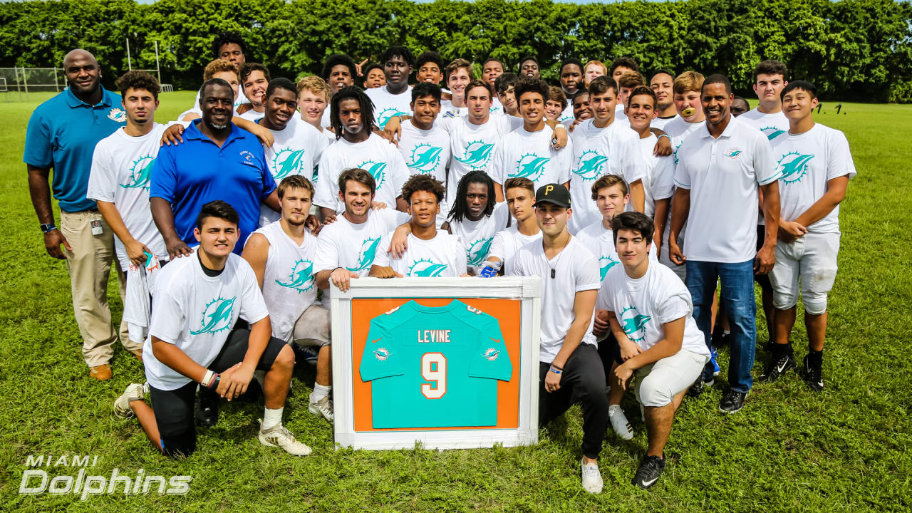 Dolphins Donate Equipment to Spanish River High School Football