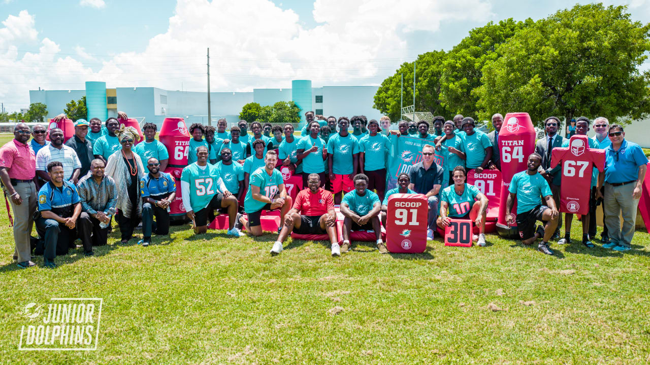 Dolphins, Baptist Health South Florida Donate Football Equipment To Edison  After Devastating Fire